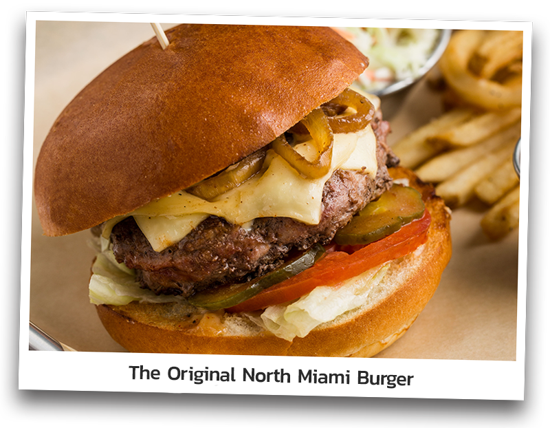 Picture the Original North Miami Burger which consists of seared premium beef &amp; pork, piled high with melted American cheese, caramelized onions, bacon aioli, pickles, tomato and lettuce between the bun and served with fries and coleslaw.