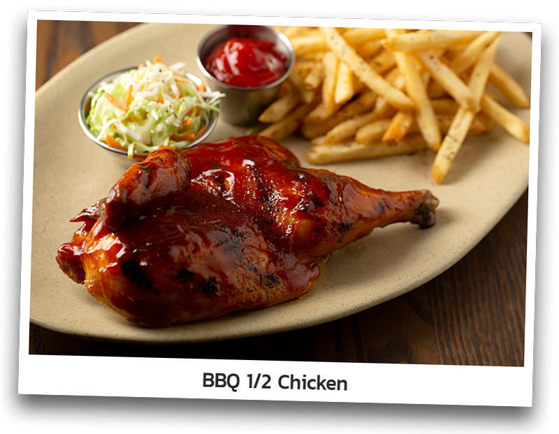 Half chicken charbroiled and basted in Original BBQ sauce. Served with coleslaw, fries and ketchup on an oval plate.