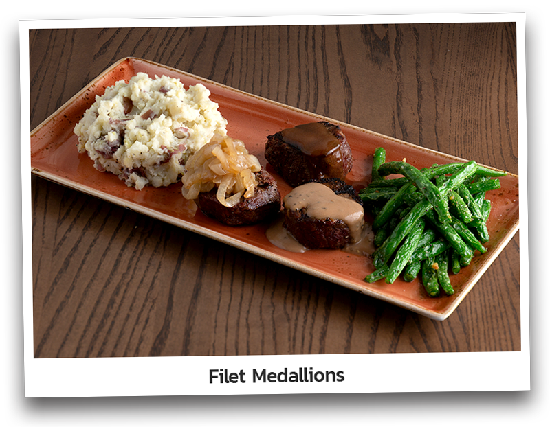 Three tender beef tenderloins seasoned and flame grilled. Served with red- skinned mashed potatoes and seared green beans. Topped with caramelized onions, Cabernet Demi-Glace and Brandy Peppercorn sauce.