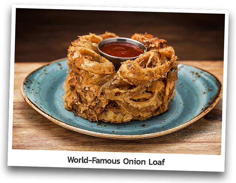 Onion Loaf that consists of yellow onions with crispy breading and lightly seasoned. Served with Original BBQ sauce.